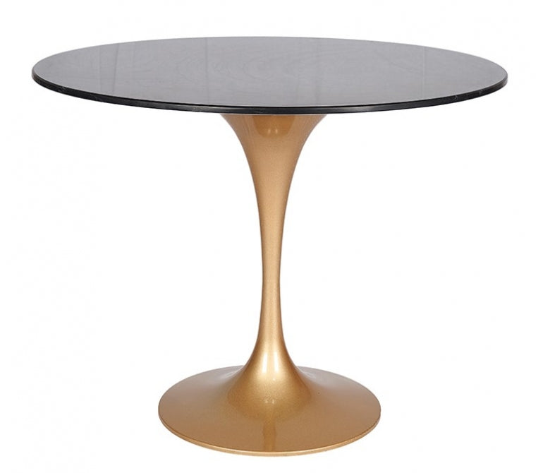 Table de salle à manger avec base en or et plateau en marbre noir